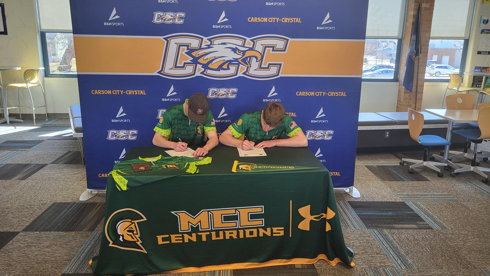 Two future MCC student-athletes signing their letters of intent at Carson City-Crystal High School.
