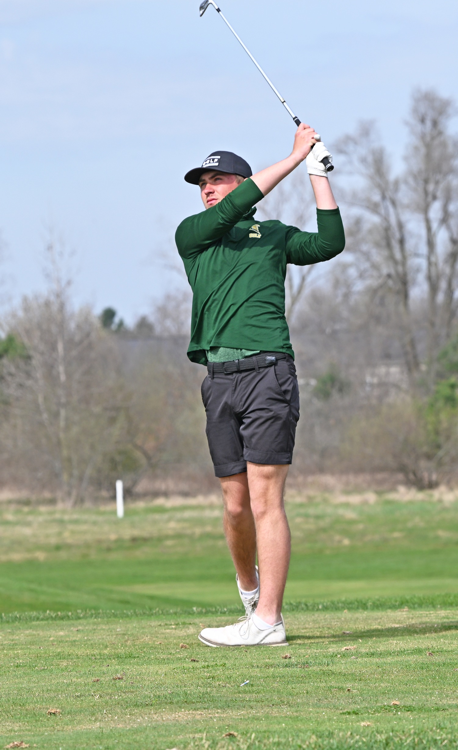 MCC Golfer on the course hitting the ball. 