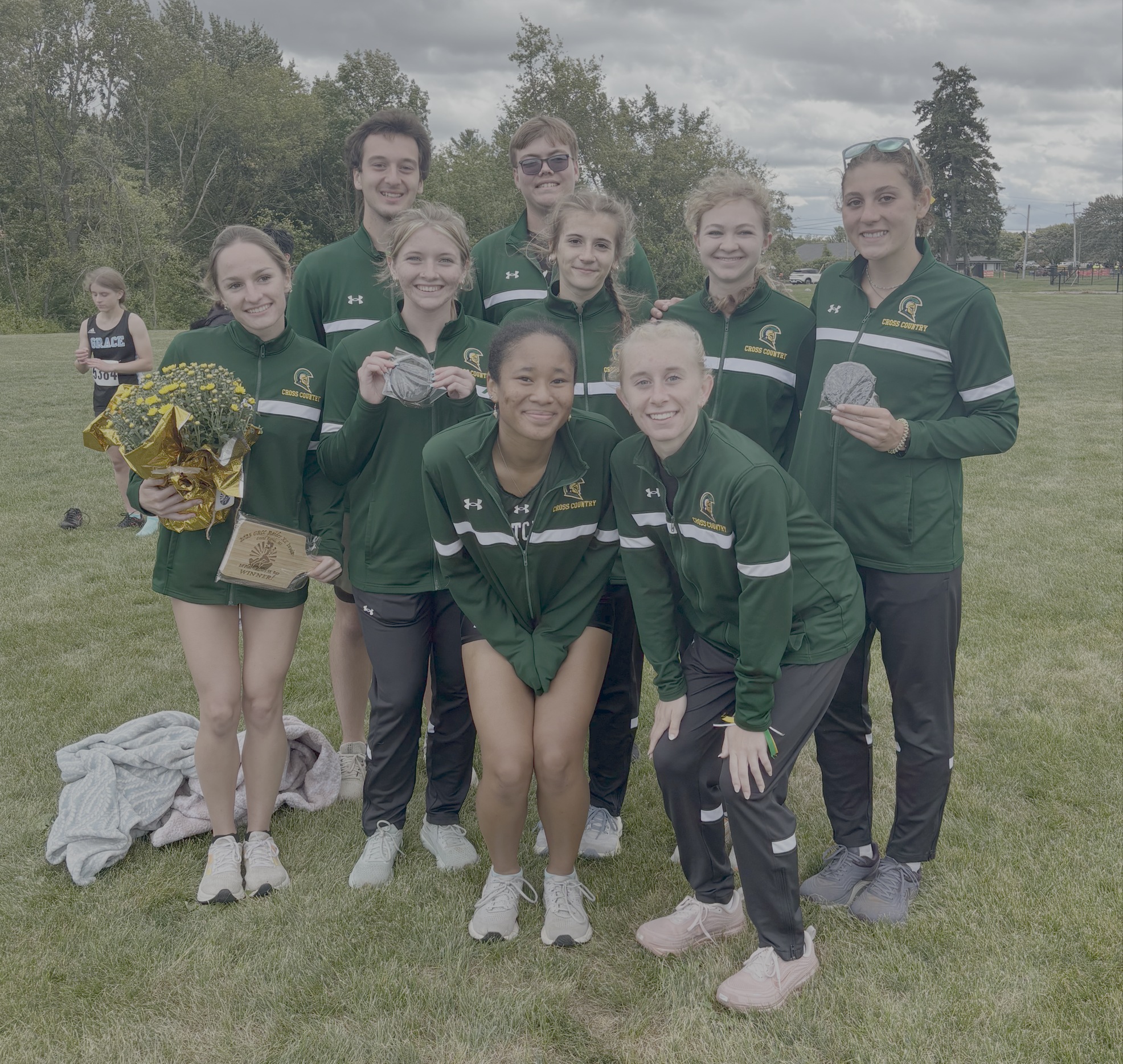 Team photo of the 25-26 cross country team at the GRCC Invitational. 