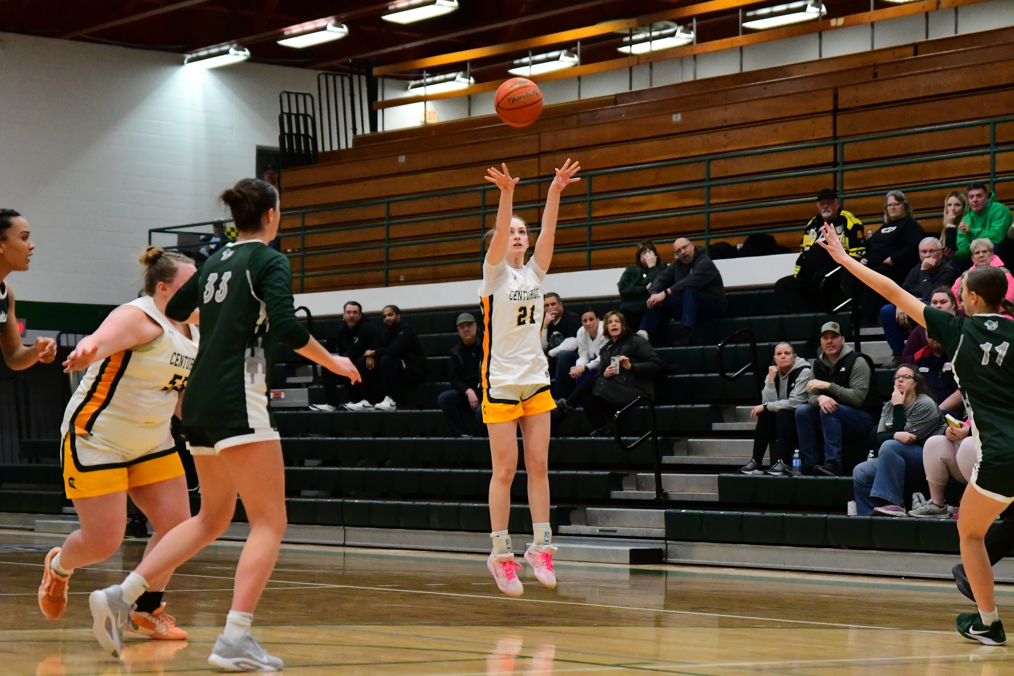 MCC women's basketball player jumping to shoot the ball during a game.