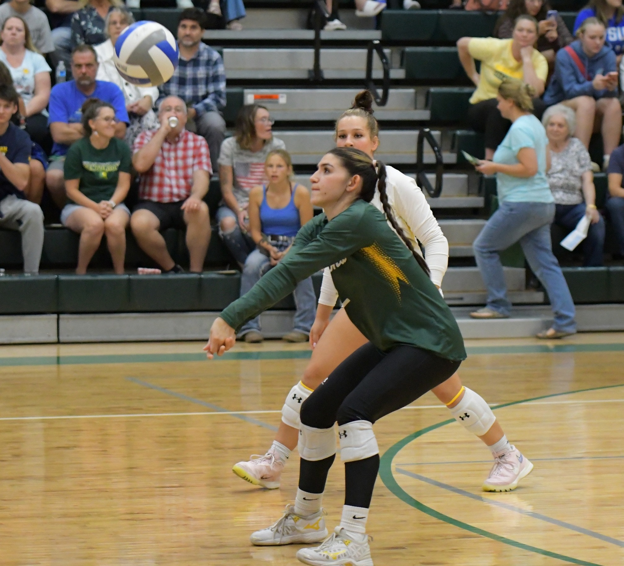 MCC Volleyball player Jaden Gomez bumping the ball during a game.