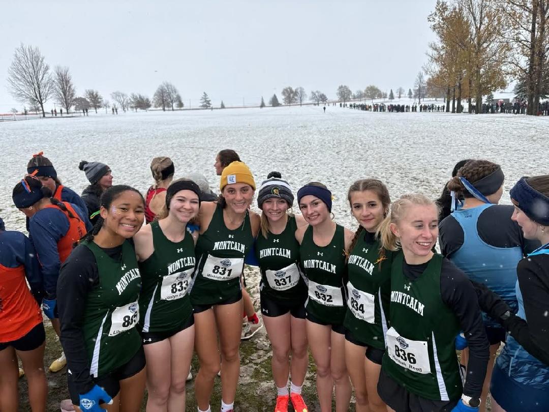 MCC's women's cross country team pictured outside with snow on the ground behind them as they prepare for the NJCAA Division II National Championship meet.